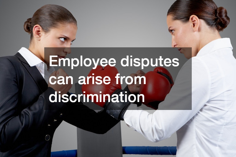 two female employees wearing boxing gloves